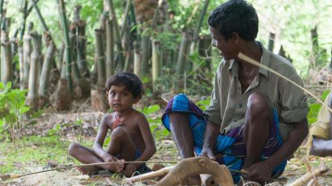 Tribal man with her child